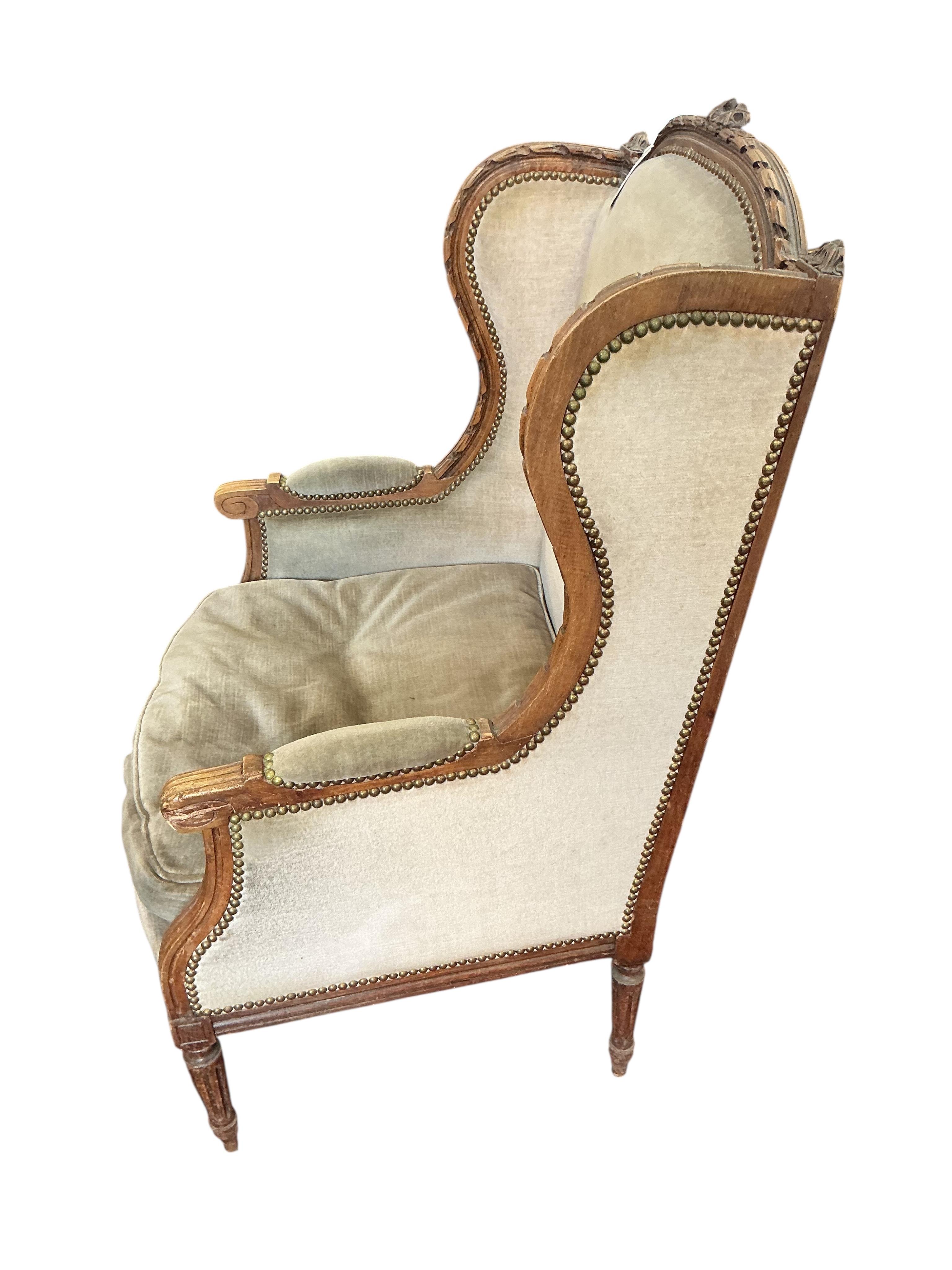 A late19th century French carved beech wing armchair, width 60cm, depth 52cm, height 104cm